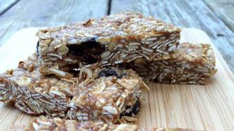 Almond oat bars served on a wooden cutting board