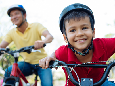 A father and young son out bicycling together